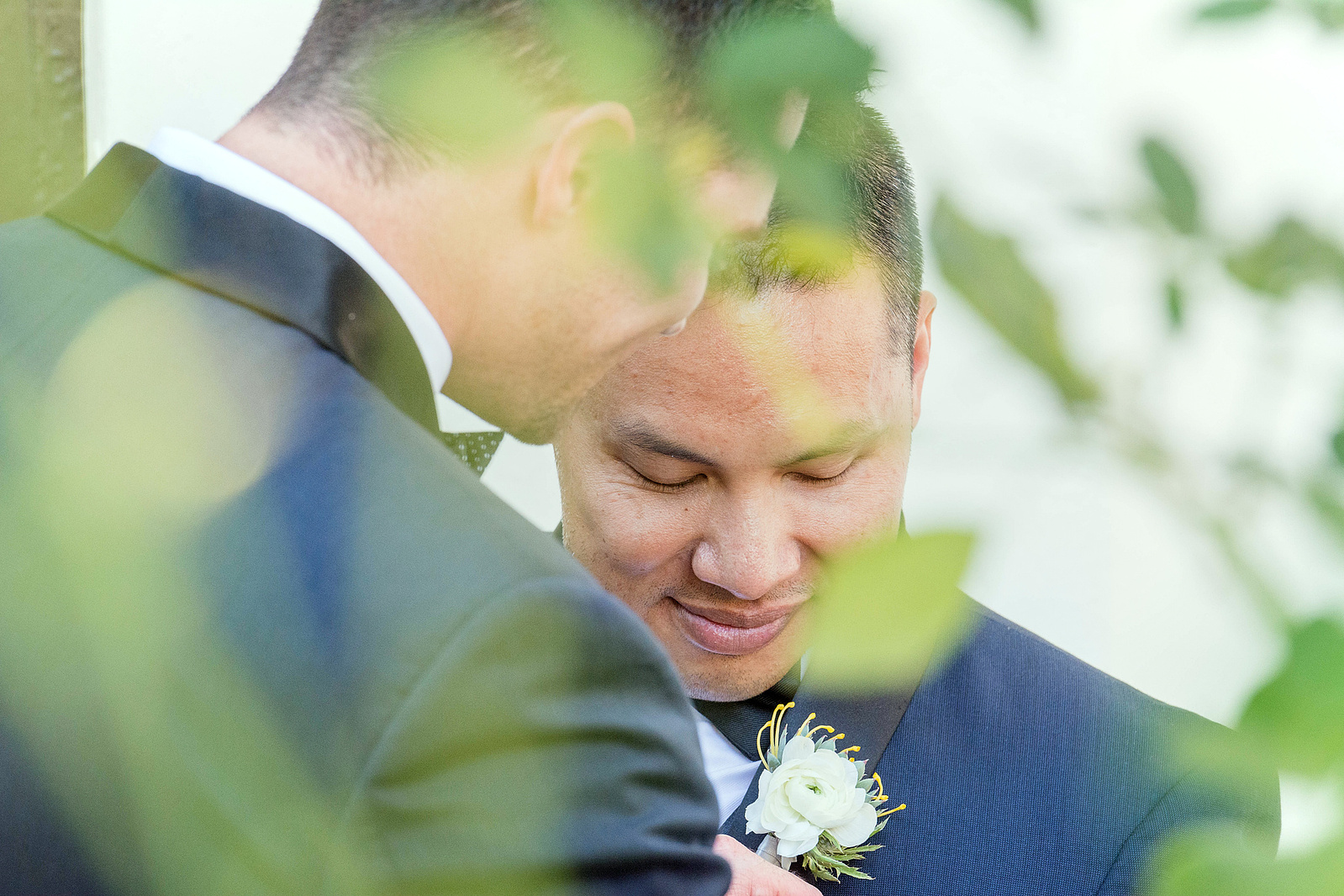 Grooms at first look during an LGBTQ wedding in San Diego, California.