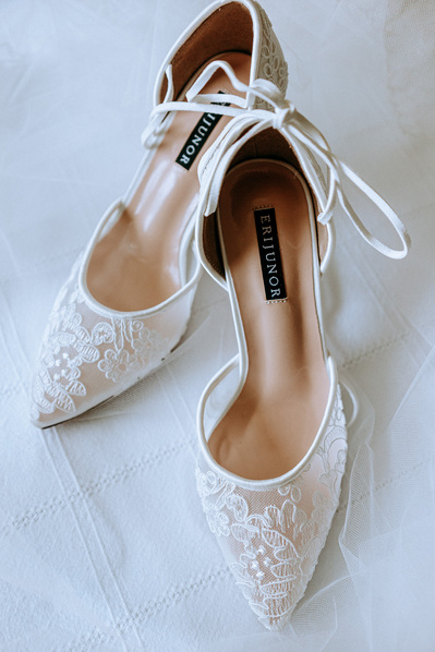 Elegant bridal shoes with lace and heels.