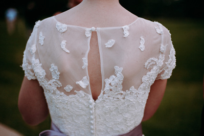 Details of the back of a lace wedding dress.