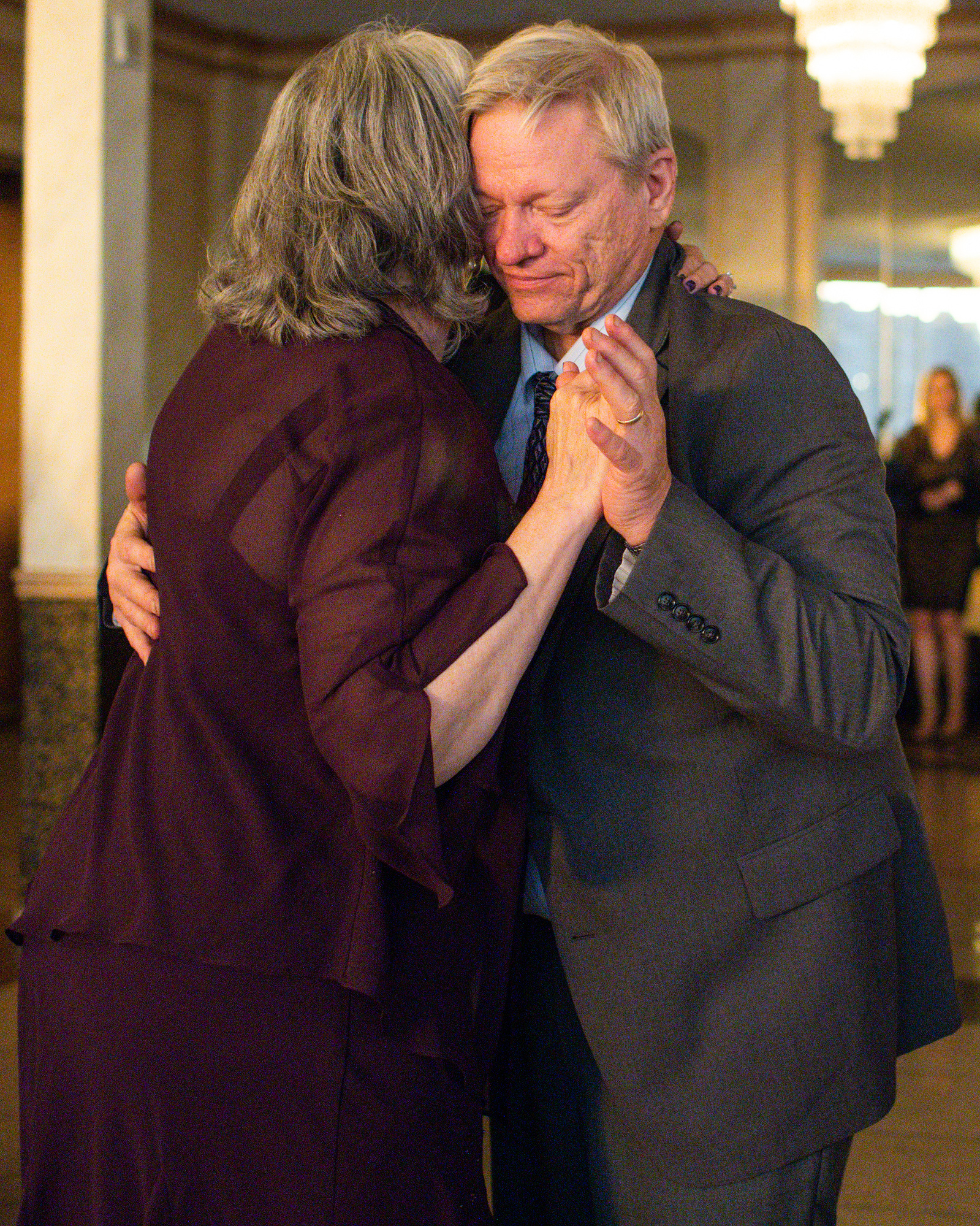 Wedding guests slow dance. Wedding photojournalism at Giando on the Water in Brooklyn, NY. 