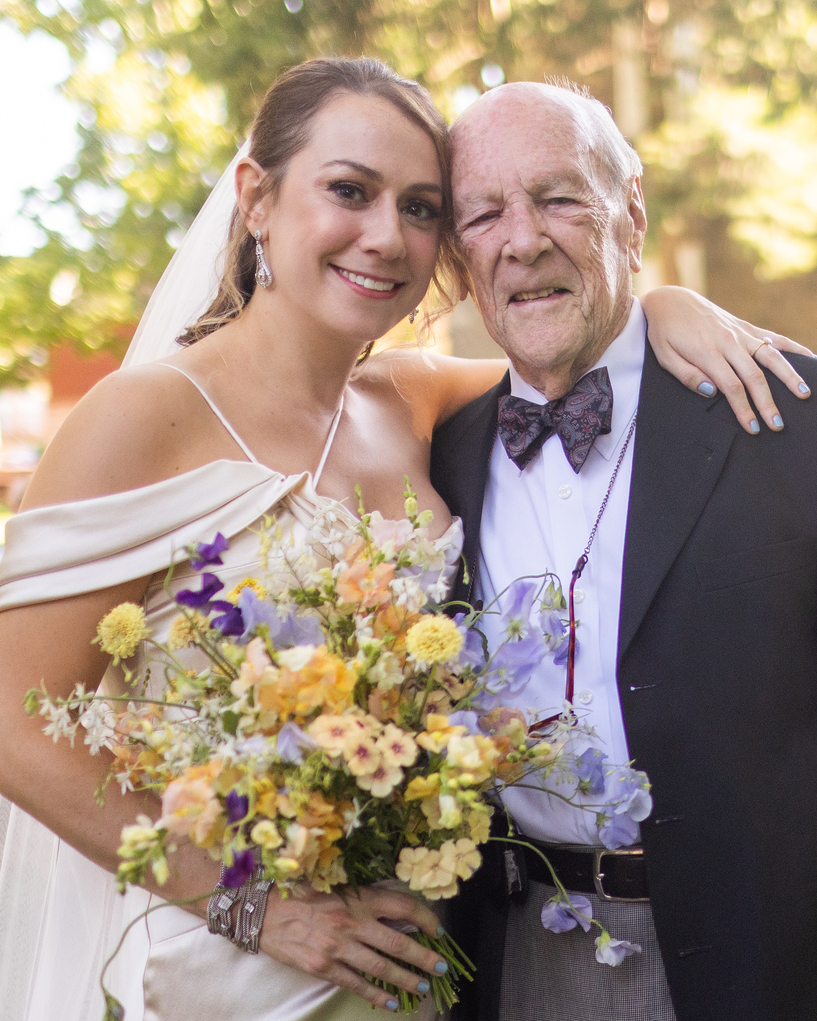Bride and grandfather look directly at camera. Wedding photojournalism at Senate Garage in Kingston, NY.