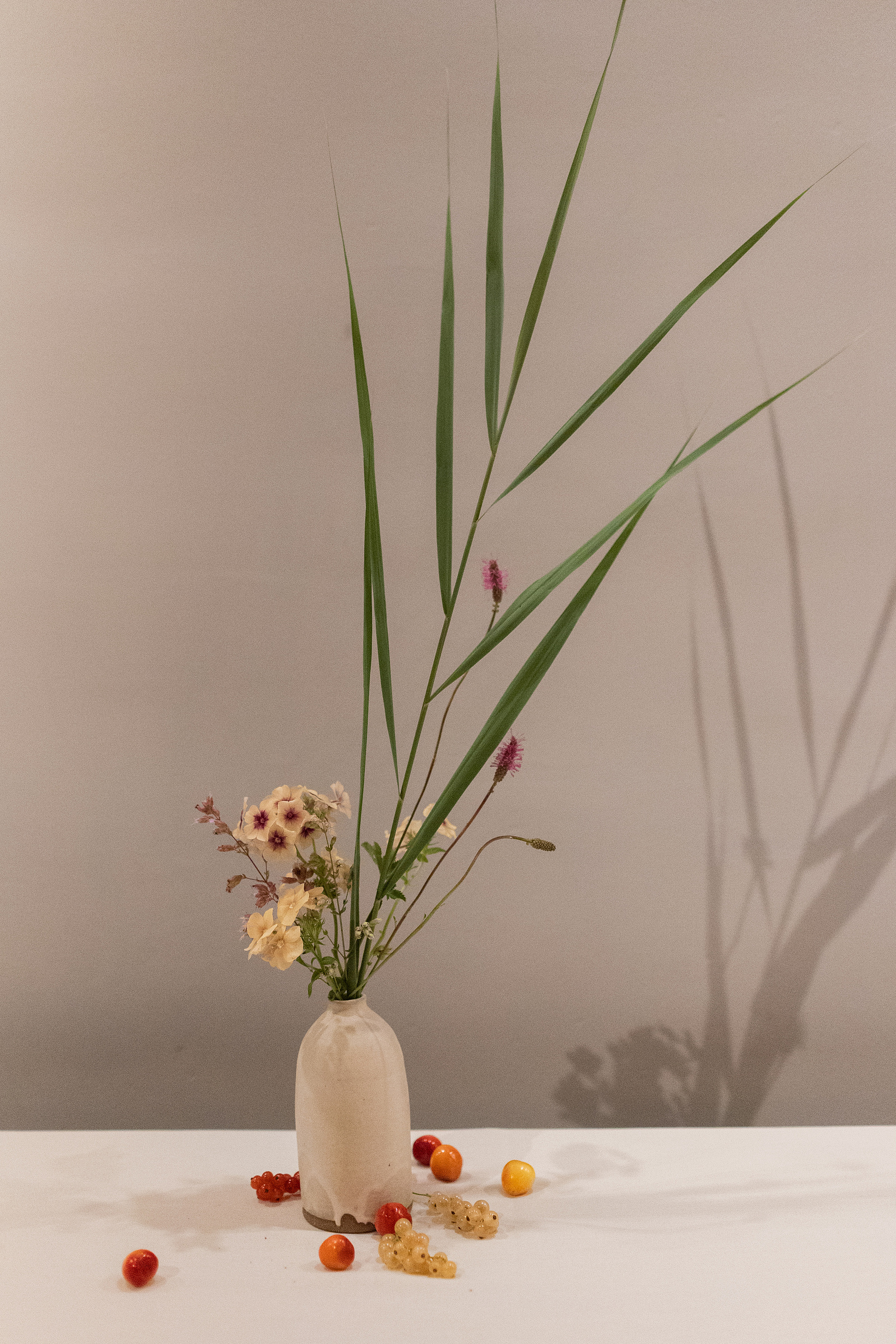 Palm frond flower arrangement. Wedding photojournalism at Senate Garage in Kingston, NY.