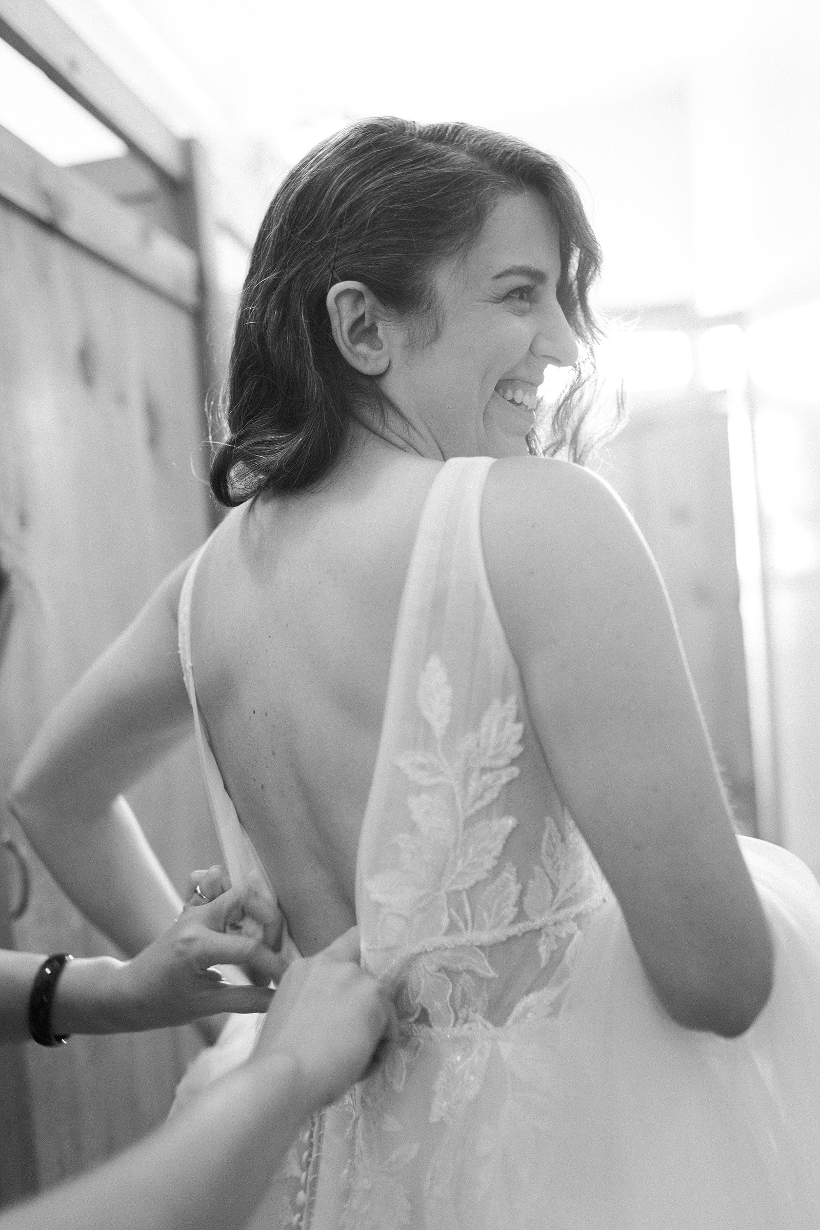 Bride getting dressed. Blooming Hill Farm. Wedding photojournalism
