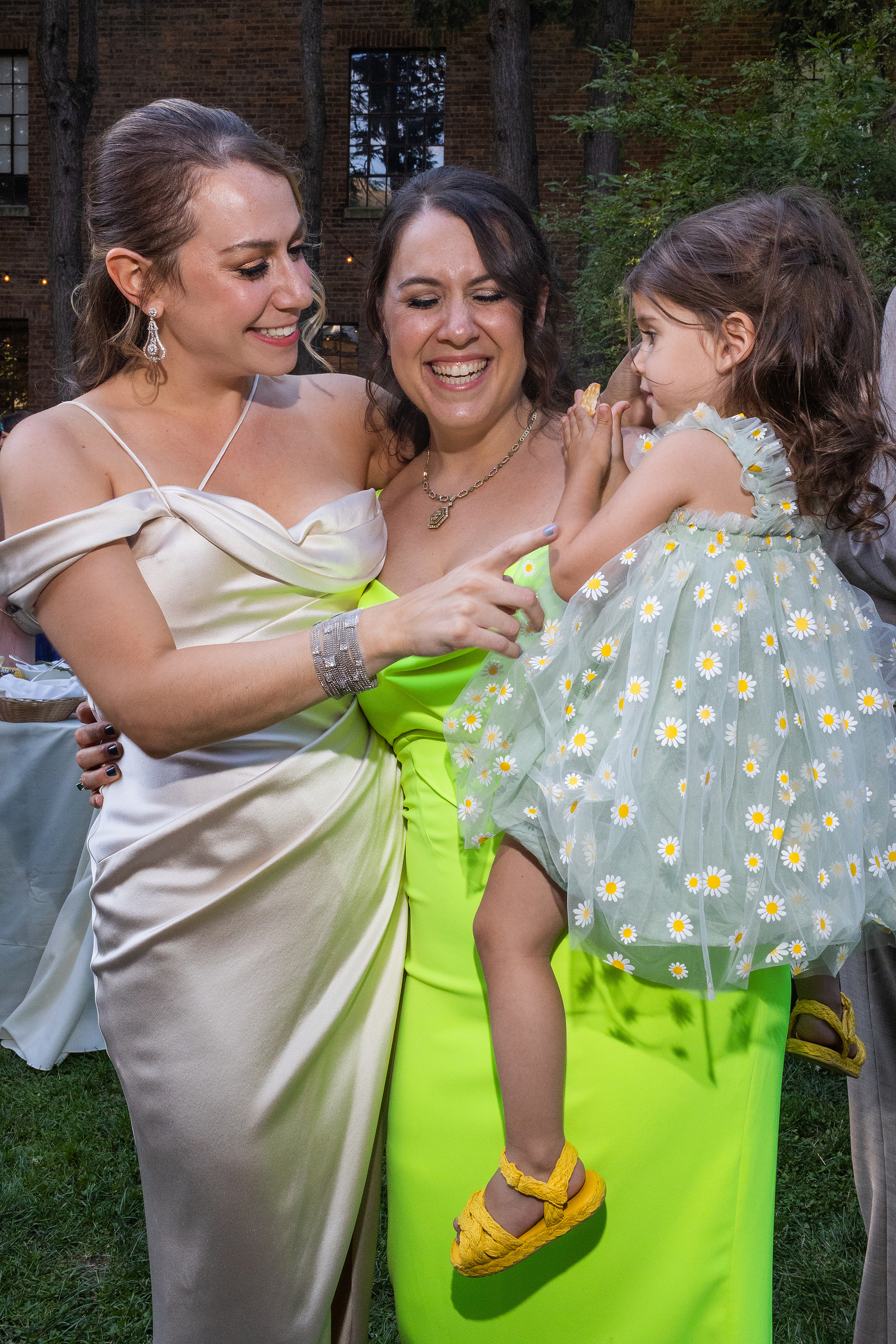 Bride, sister and niece. Wedding photojournalism at Senate Garage in Kingston, NY.
