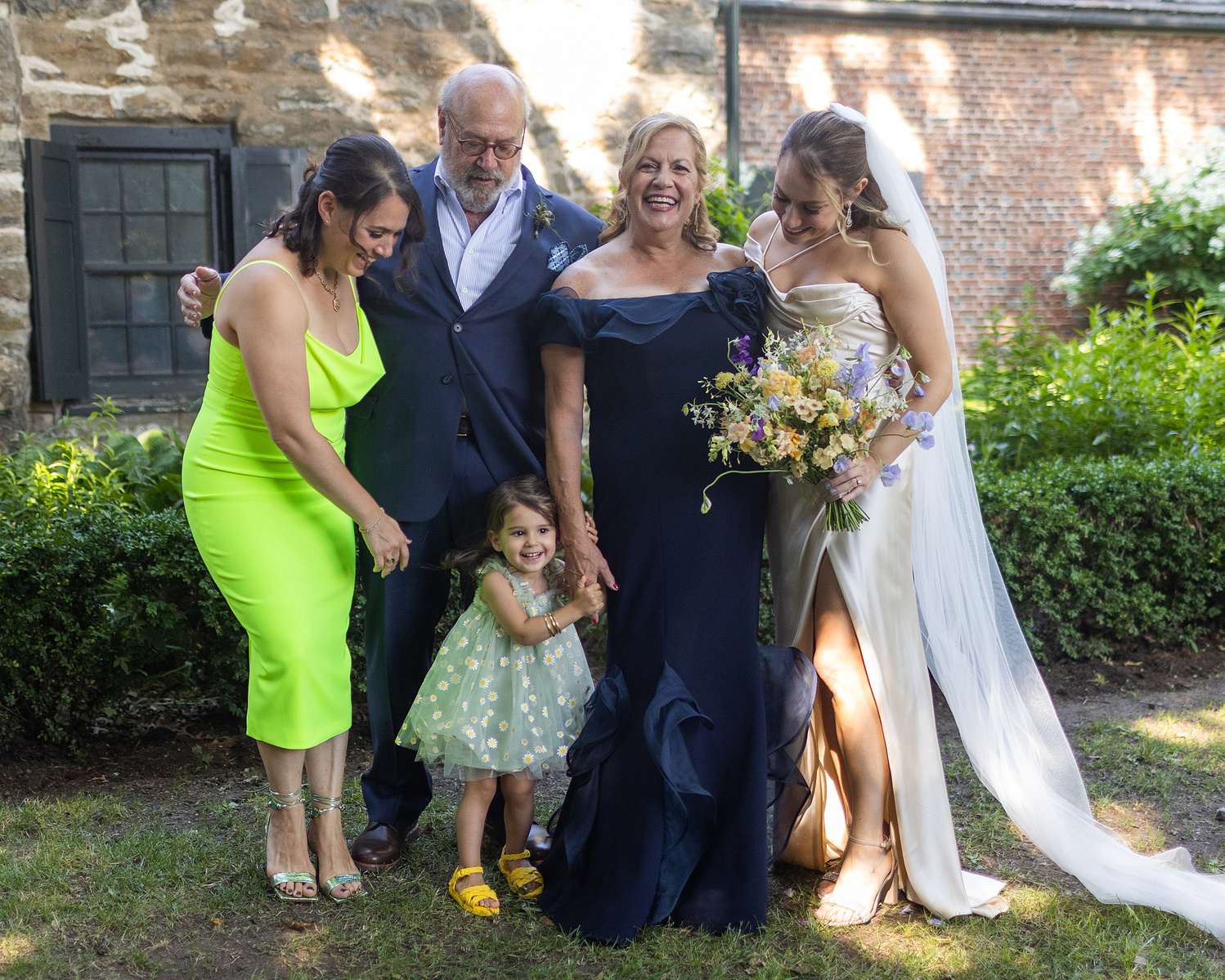 Family portrait. Mother of the bride looking at the camera. Wedding photojournalism at Senate Garage in Kingston, NY.