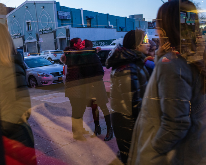 Alexandria Ocasio-Cortez is embraced by her Campaign Manager outside the Corona Diner, where she was co-hosting an event to spread awareness about the census in neighborhoods that are historically undercounted.