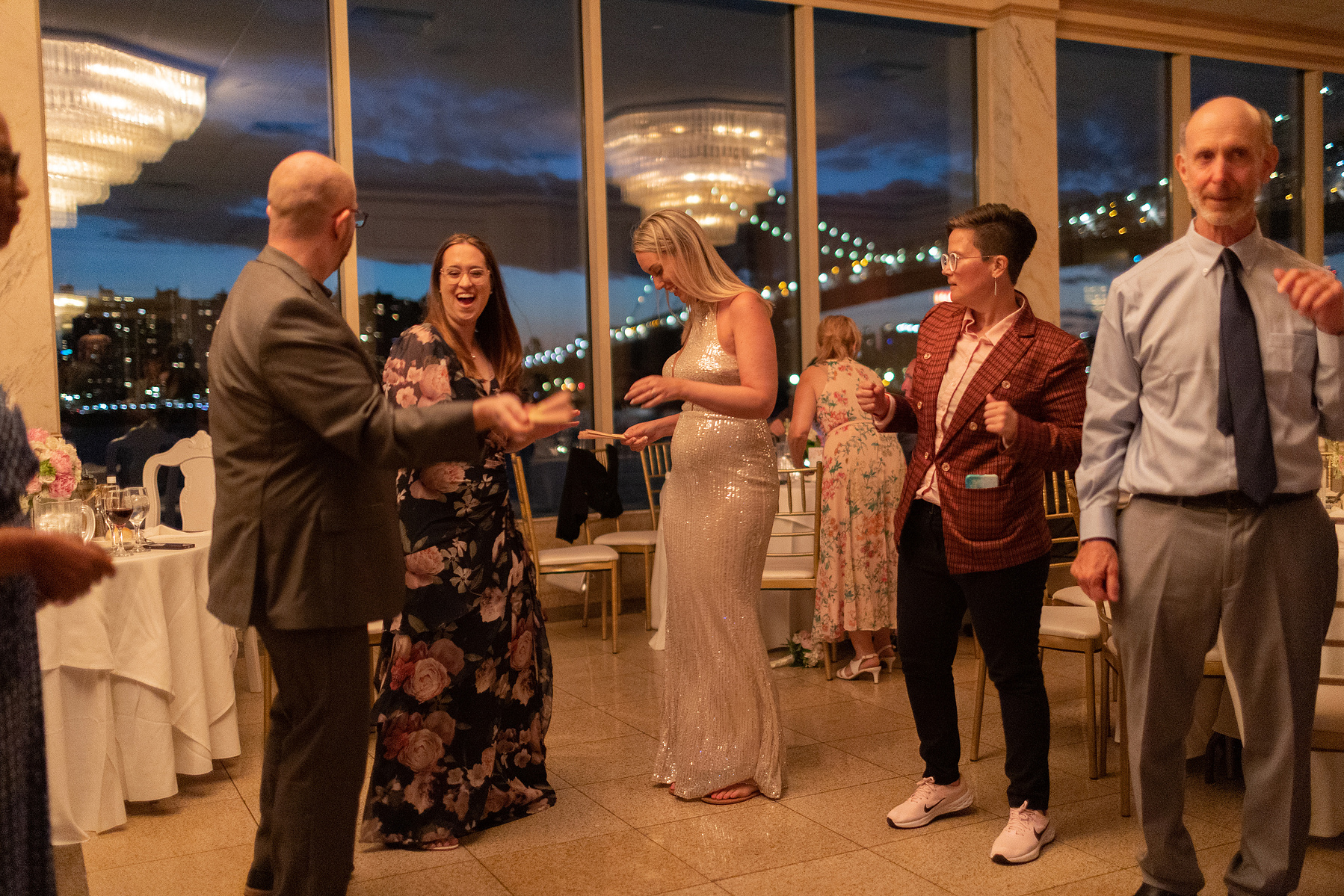 Wedding guests dance. Wedding photojournalism at Giando on the Water in Brooklyn, NY. 