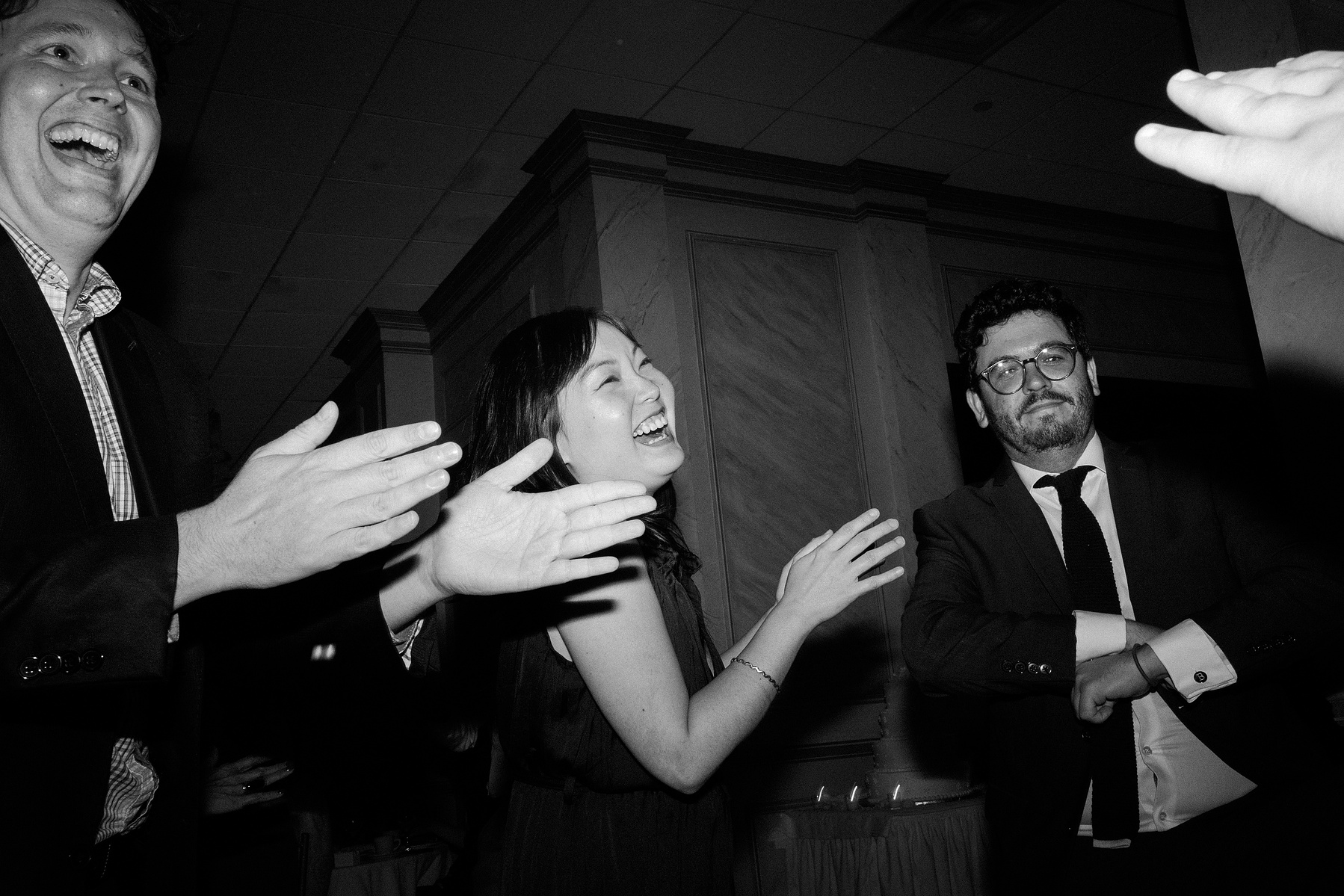 Wedding guests dancing. Wedding photojournalism at Giando on the Water in Brooklyn, NY. 