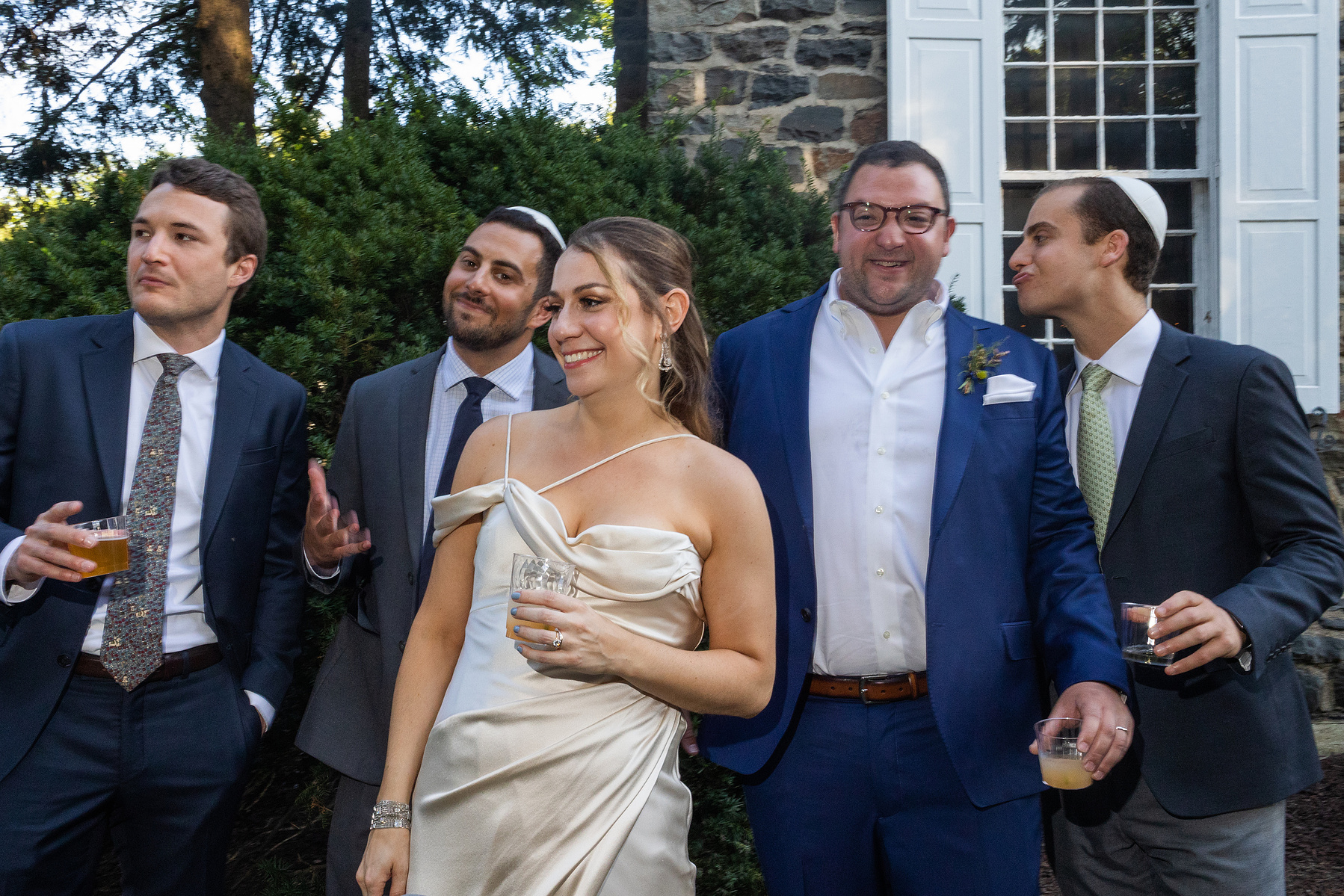 Bride and Groom with three wedding guests. Wedding photojournalism at Senate Garage in Kingston, NY.