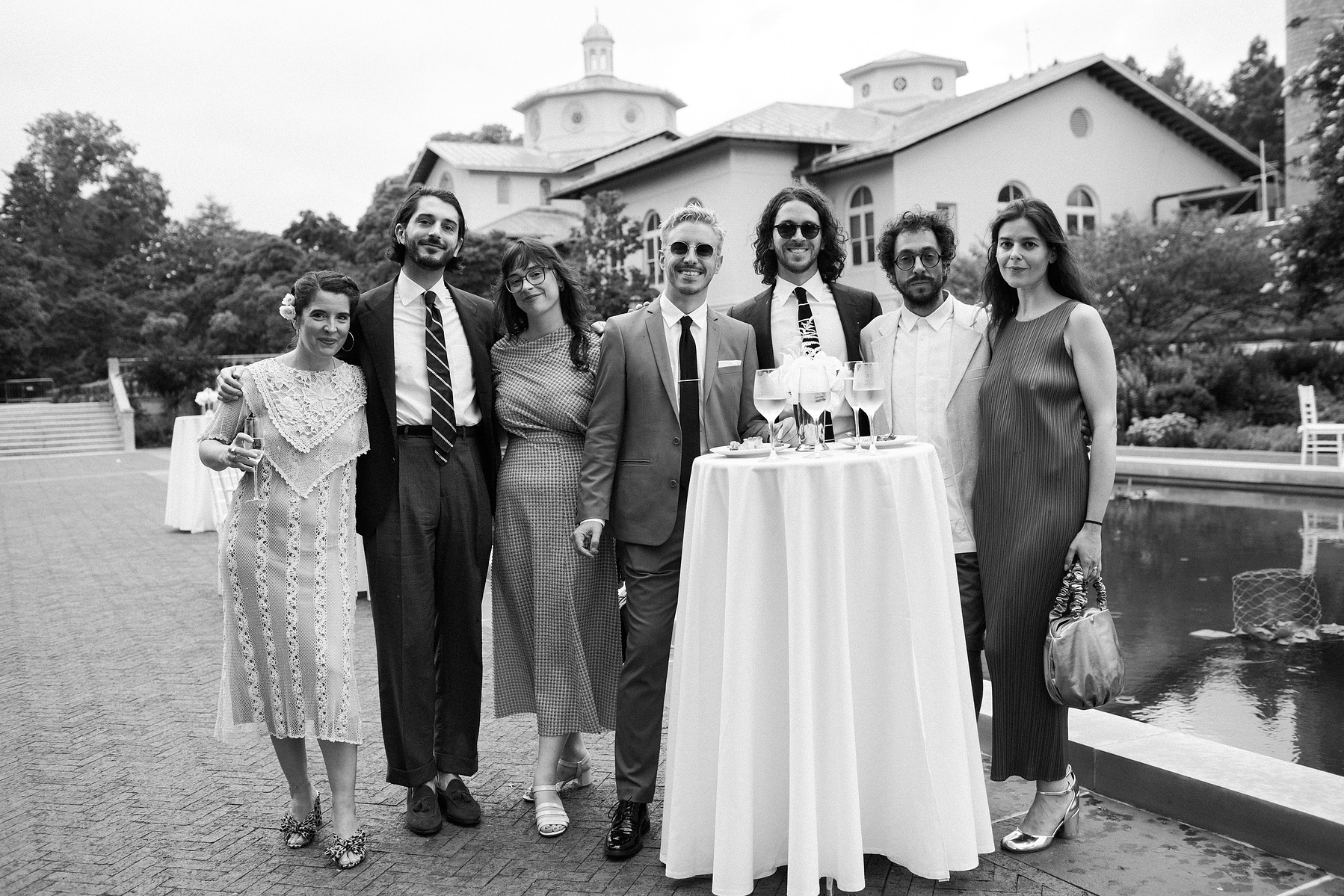 Brooklyn botanical gardens summer wedding guests at cocktail hour. Corey Torpie Wedding Photojournalism.