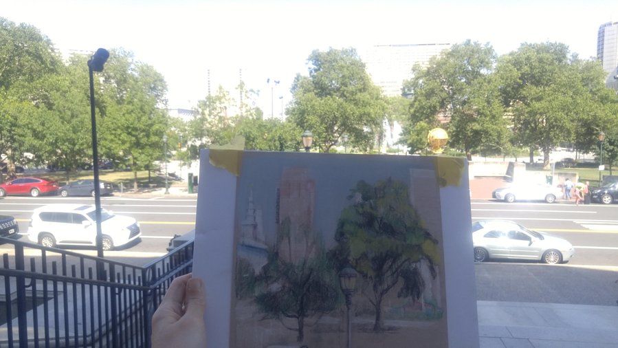 Photo comparison of artwork with Logan circle after completing plein air.