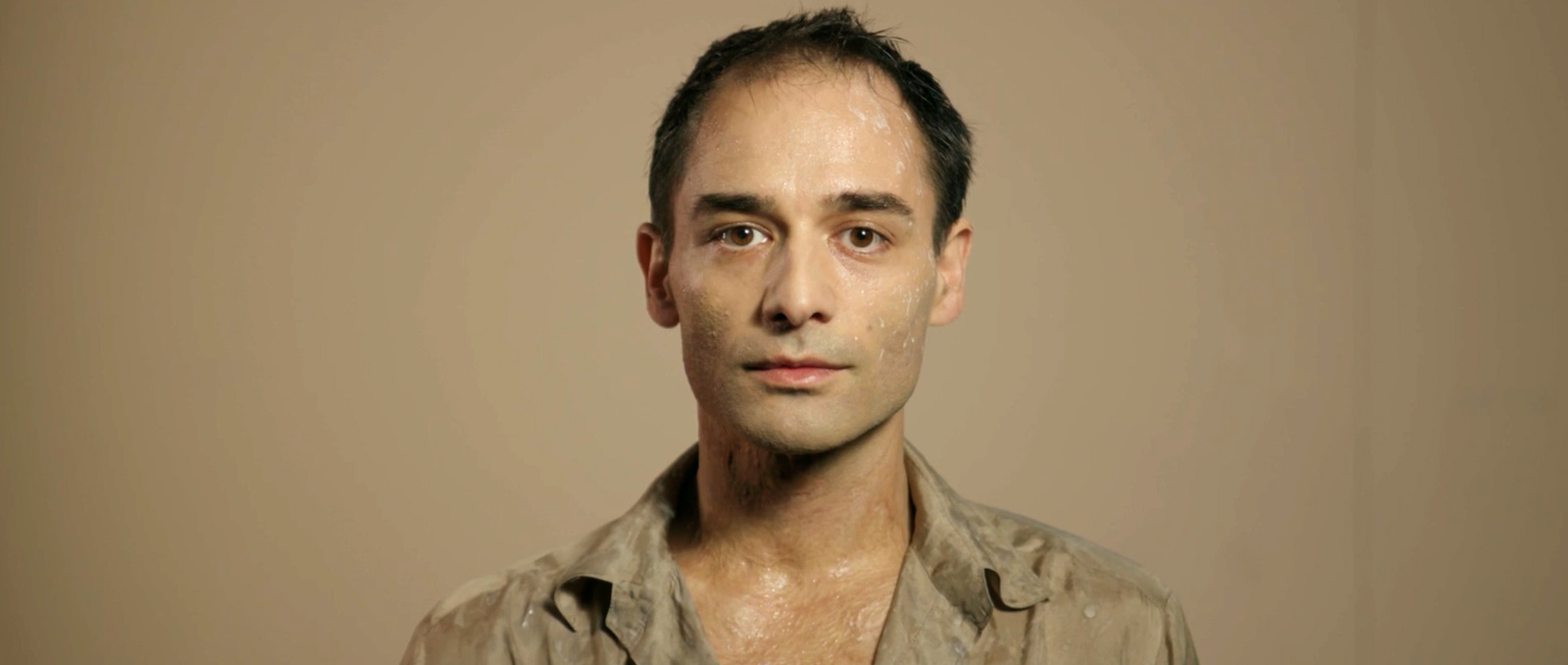 Still image of Dragan Bakema as Newton in the trailer for David Bowie's Lazarus.