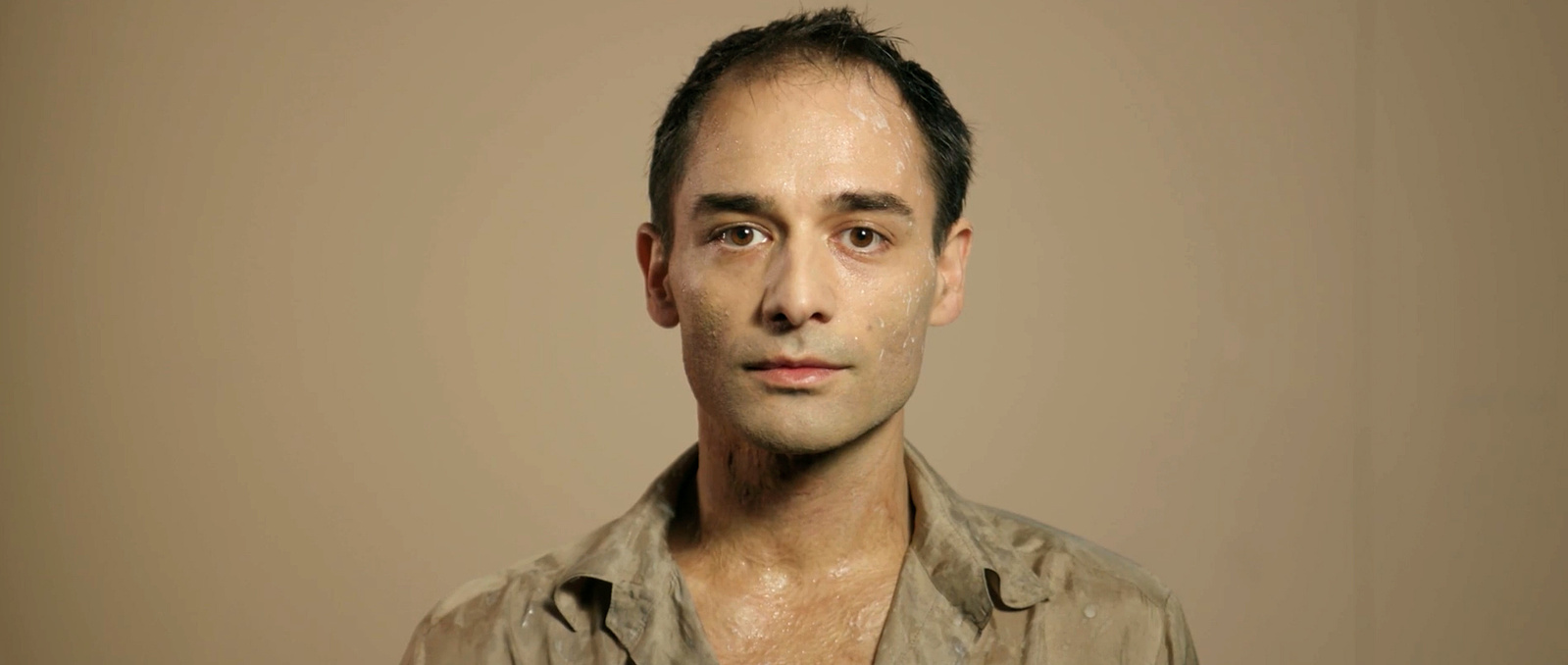 Still image of Dragan Bakema as Newton in the trailer for David Bowie's Lazarus.