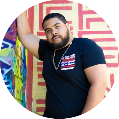 Model Robert M poses for Realest Exposure in Balmy Alley, Mission District. Book San Francisco Portrait Photographers Trayvon 
