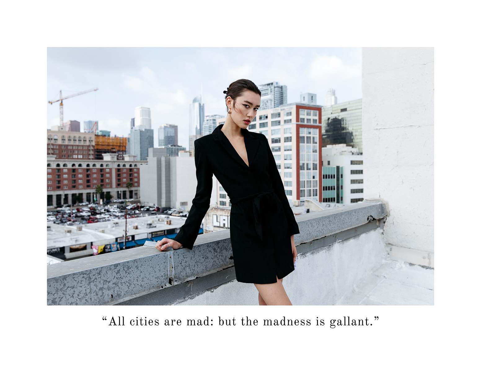 City Life in Downtown LA girl rooftop fashion editorial business lady blazer dress fashion photo editorial NYC la downtown city chic slicked back hair business women fashion photography skyline photographer sleek sophistication by Karinna Gylfphe Pho