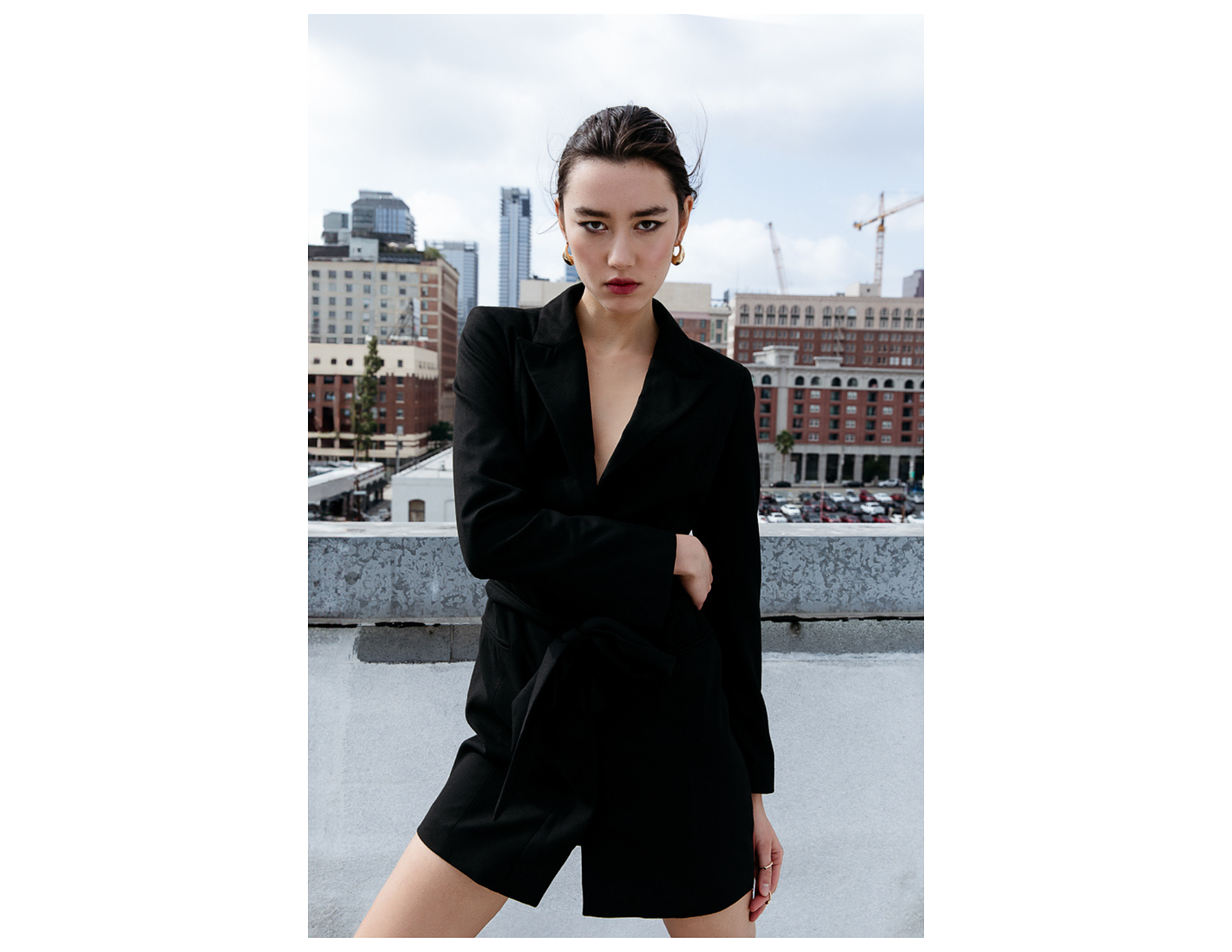 City Life in Downtown LA girl rooftop fashion editorial business lady blazer dress fashion photo editorial NYC la downtown city chic slicked back hair business women fashion photography city skyline LA photographer sleek sophistication by Karinna Gyl