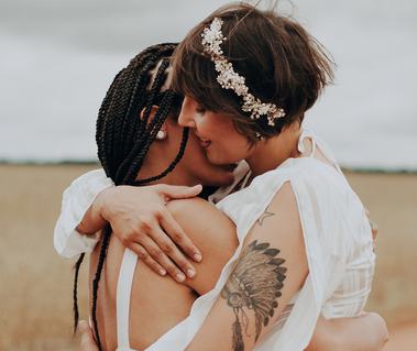 Lesbian Wedding Videography. A lesbian couple hugging each other. Colorado Wedding videographer.
