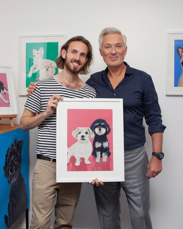 Martin Kemp receiving is custom pet portrait of his dogs Pops and Ozzy at the Wild at Heart event supported by Klarna 