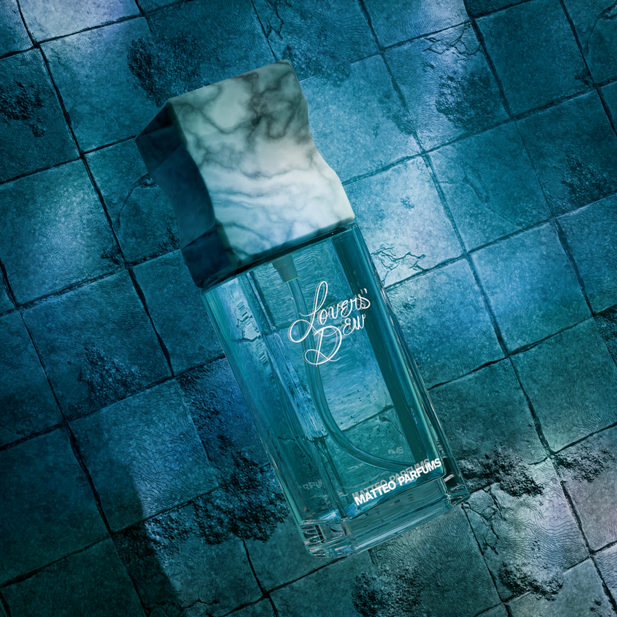 Lovers' Dew (100ml) bottle of clean, luxury niche fine fragrance eau de parfum from MATTEO PARFUMS by Matthew J. Sánchez. Aquatic, fougère, citrus, clean beauty. Aztec, cactus prickly pear, light blue. White Tuscan Italian marble cap. Refillable.