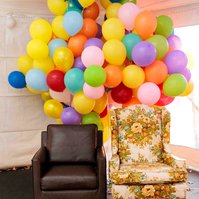 brown chair and floral chair in front of balloons inspired by the movie Up