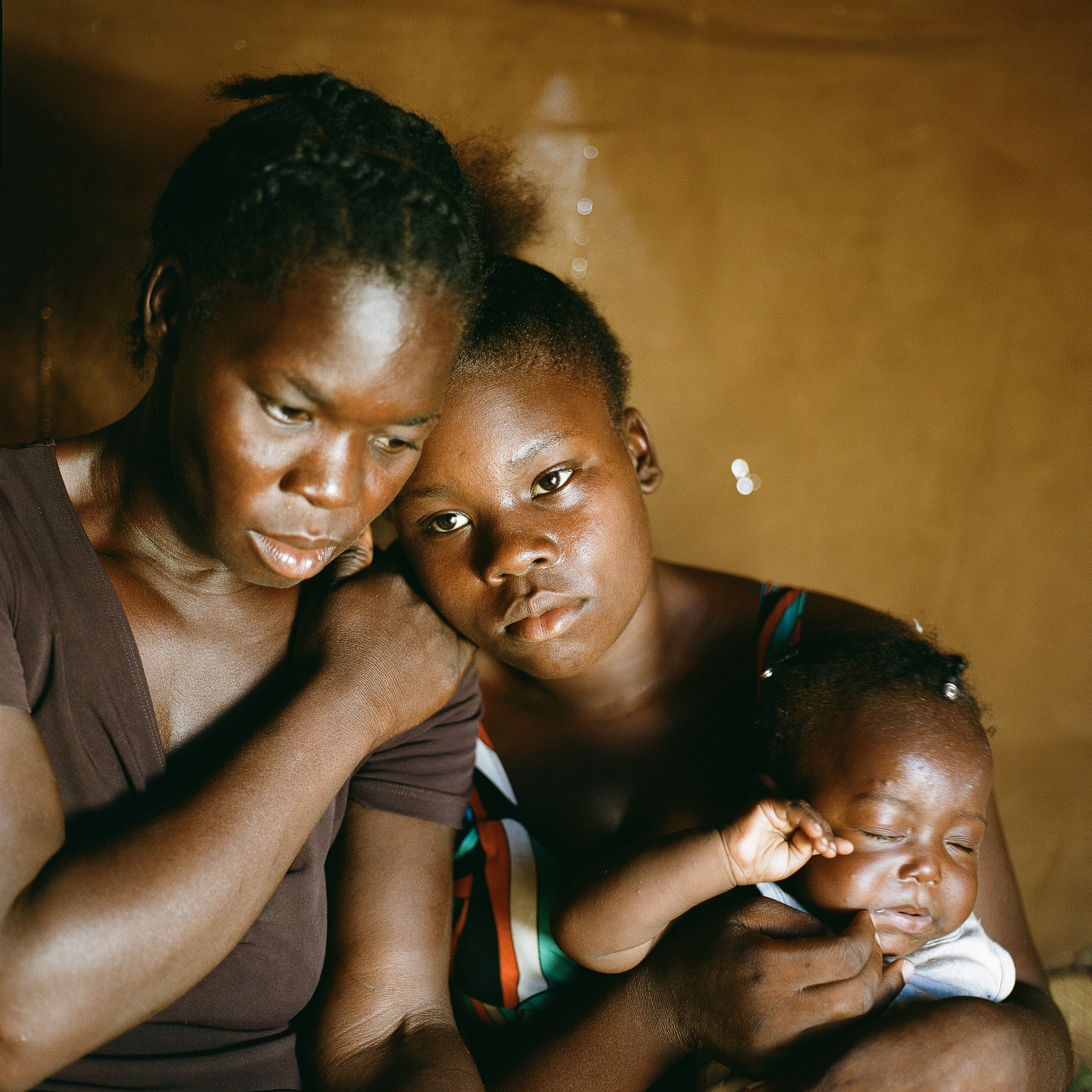 Djobina Terrello, 15, (right) who was born in Dominican Republic is now stateless and living in a displacement camp in Anse a Pitres, Haiti for five months. She lives with her mother Incecia Noel, 37 years, (left) and new born child who was born in Domini