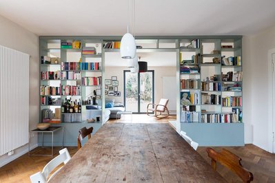 Dinning room and bookshelf in a renovated german house
