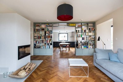 Interior of a house with a bookshelf in the middle