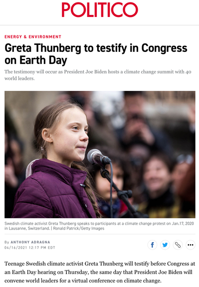 Greta Thunberg speaks on the microphone to a huge audience in Lausanne, Switzerland