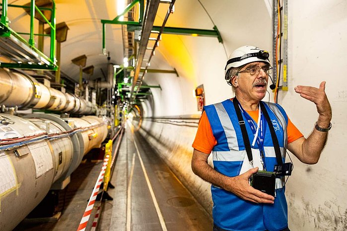 Reiner Schicher, a scientist from the University of Heiodelberg talks to visitors inside the tunnels at ALICE Experiment at the CERN (European Nuclear) particle physics research facility in Meyrin, Switzerland.