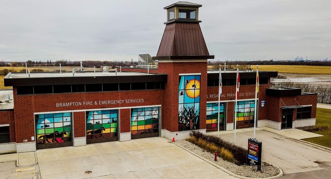 A mural printed on perforated vinyl was installed on five garage doors and the tower windows. The mural design features Brampton's agriculture, the countryside, deer, horses, and cattails.