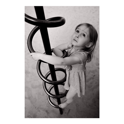 family photography of young girl playing on playground in Milwaukee, Wisconsin