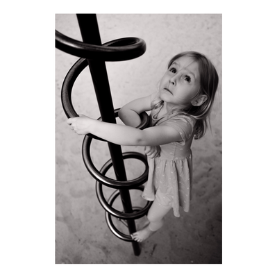 family photography of young girl playing on playground in Milwaukee, Wisconsin