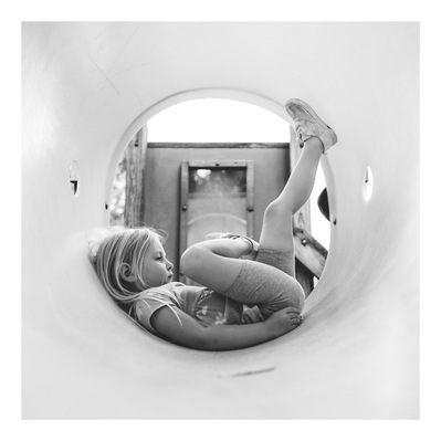 family photography of young girl playing at the playground in Milwaukee, Wisconsin.