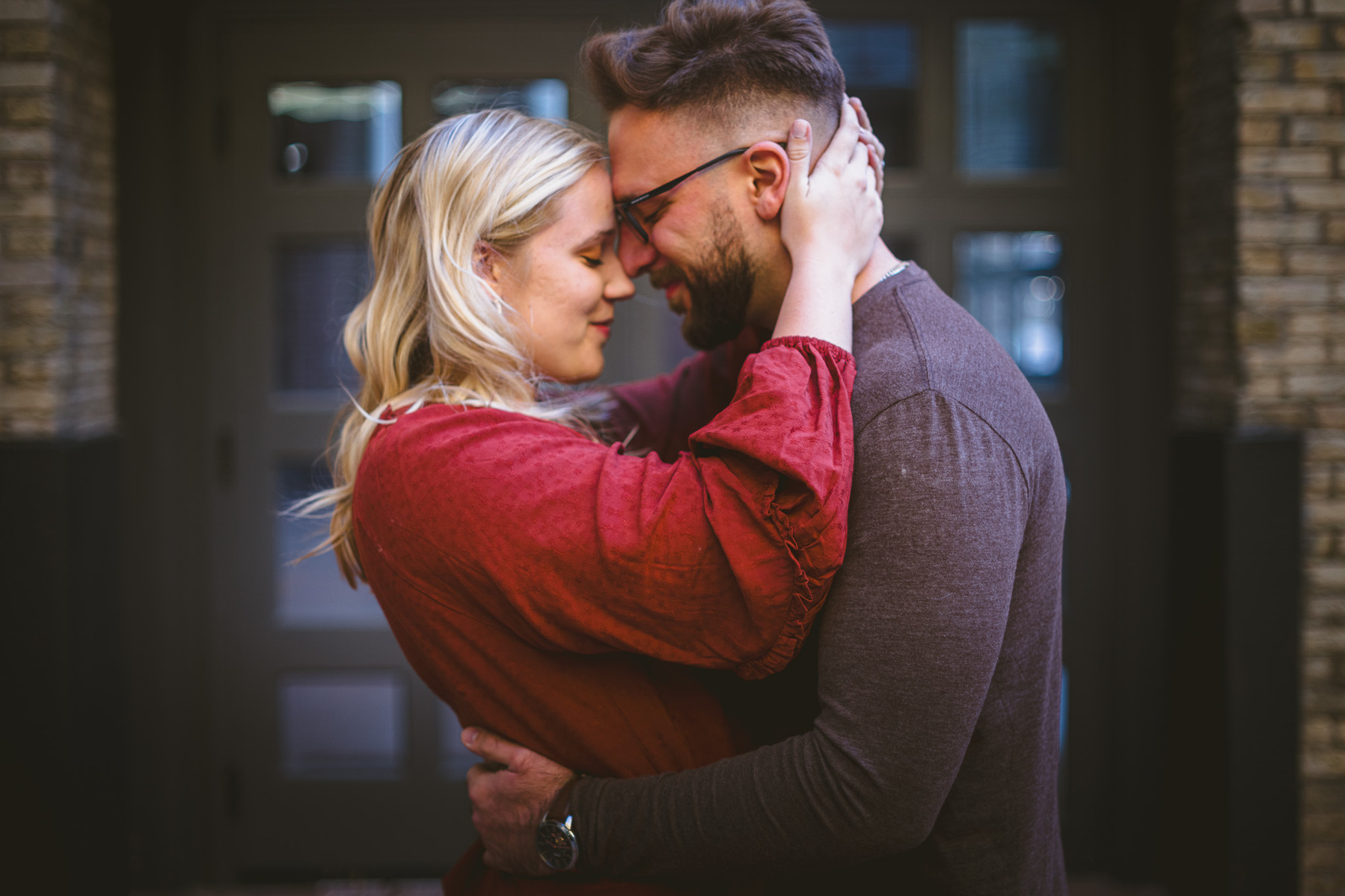 Pritzlaff, Milwaukee, third ward engagement session, couple hugs each other in touches foreheads