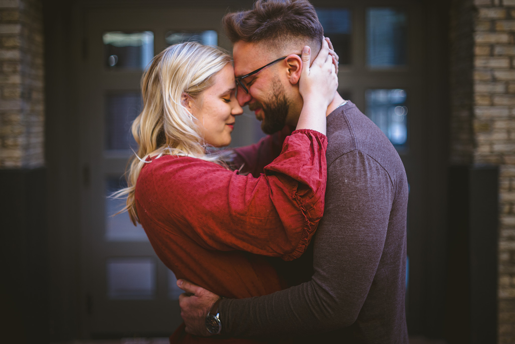Pritzlaff, Milwaukee, third ward engagement session, couple hugs each other in touches foreheads