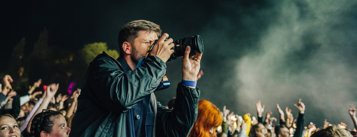 Michal Augustini in action photographing Colours of Ostrava festival, Czech Republic - July 2022
