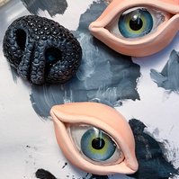 Small sculptures of eyes and a dog nose by @benandjulia