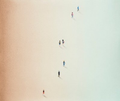A colour pencil drawing of tiny figures viewed from above. The figures are walking from the bottom of the page towards the top in a loose line. There is a gradient from brown to blue across the paper. A slight shadow is cast by each person.