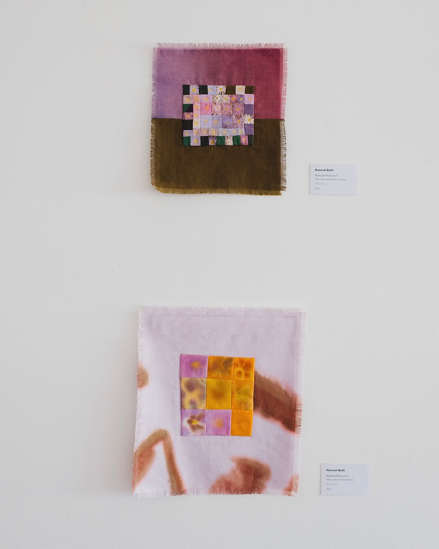 An install shot artworks Backyard Beacons 1 and 2 against a white wall.