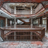 Captivating light court in the abandoned Farwell Building, Detroit, MI. Exquisite woodwork and intricate railings adorn this architectural gem. A testament to Detroit's abandoned beauty, preserved in this captivating image