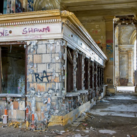 Inside the abandoned Ford Michigan Central Station, the ticket booth stands as a relic. Once a symbol of Detroit's abandoned buildings, this historic site is set to be reborn as Ford Motor Company restores the iconic structure