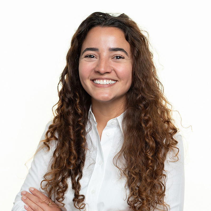 Professional headshot portrait on a clean white backdrop in studio