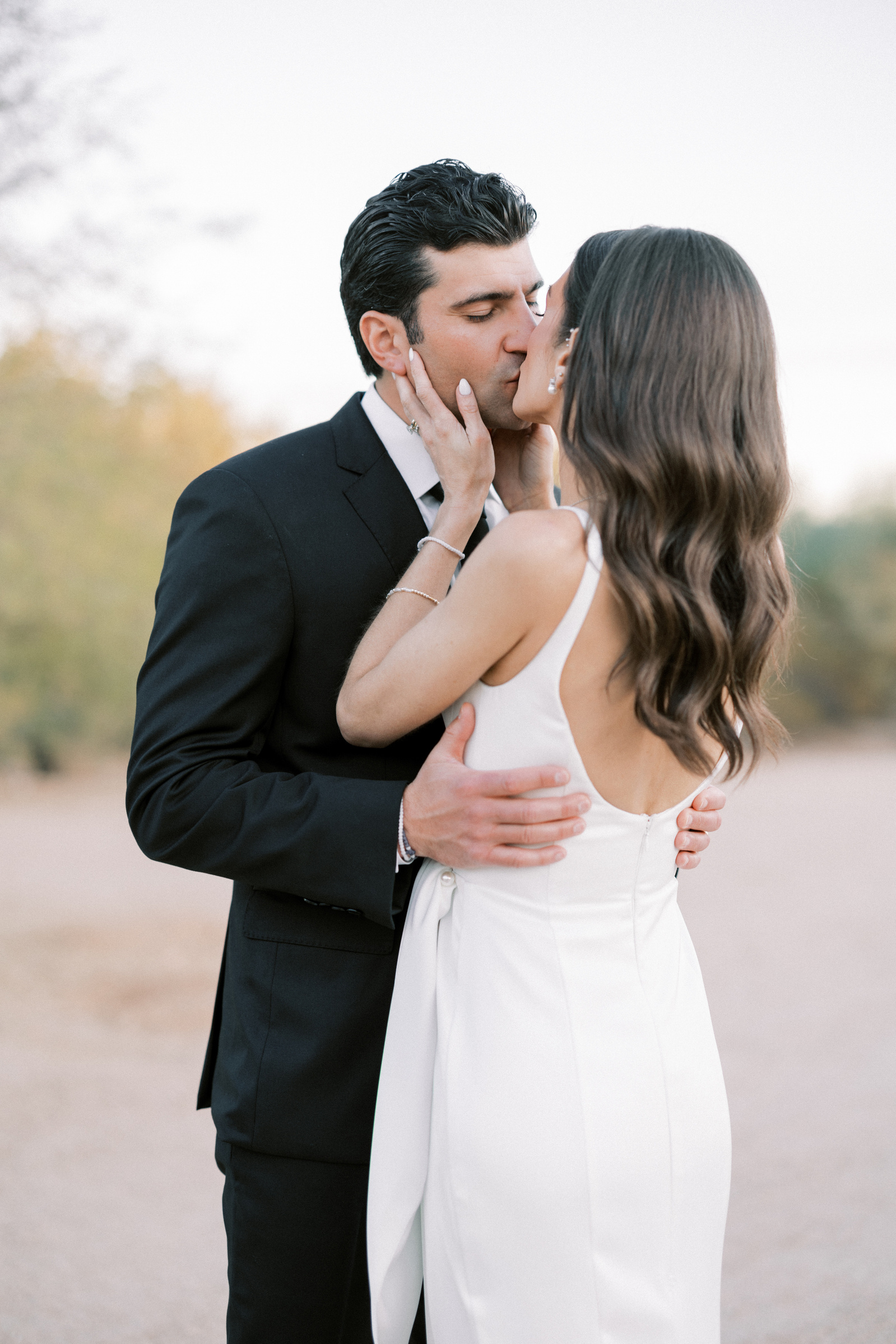 A bride and groom kiss after saying 'I do' at El Chorro in arizona 