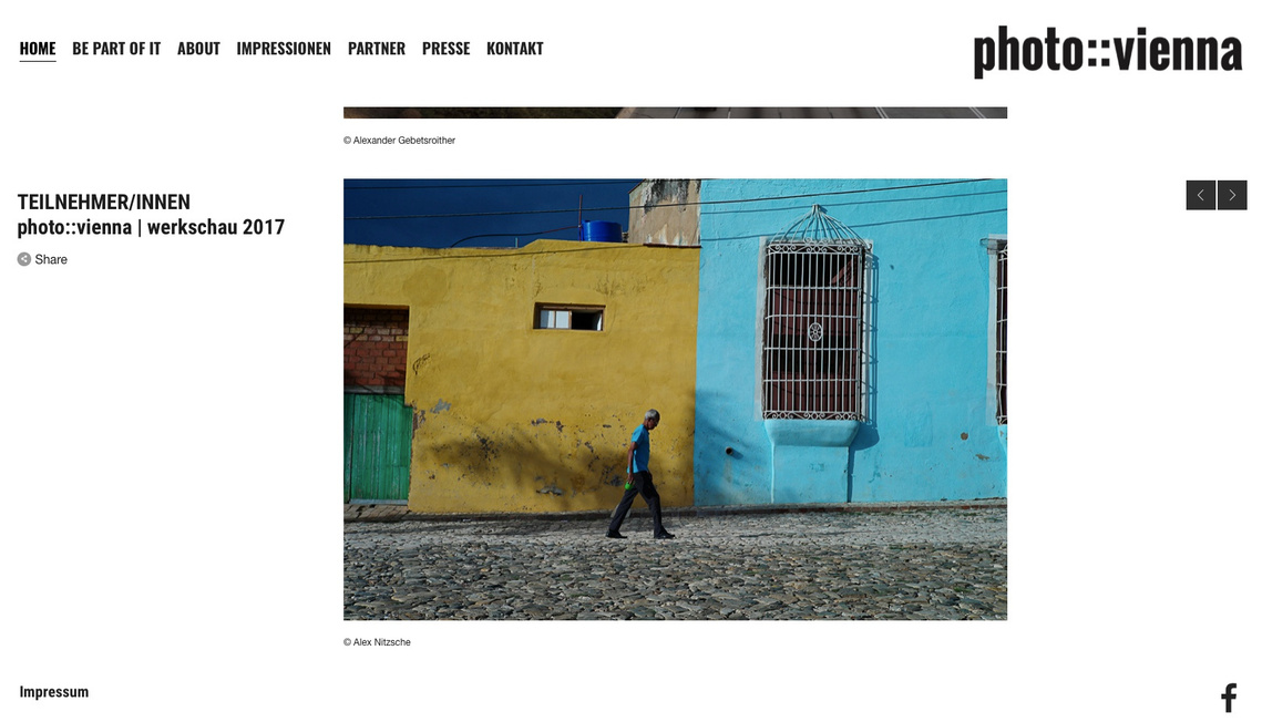 Screenshot of Alex Nitzsche contribution to the photo::vienna 2017 Werkschau from his Cuba La Calle project, a man walking in front of colourful house facades.