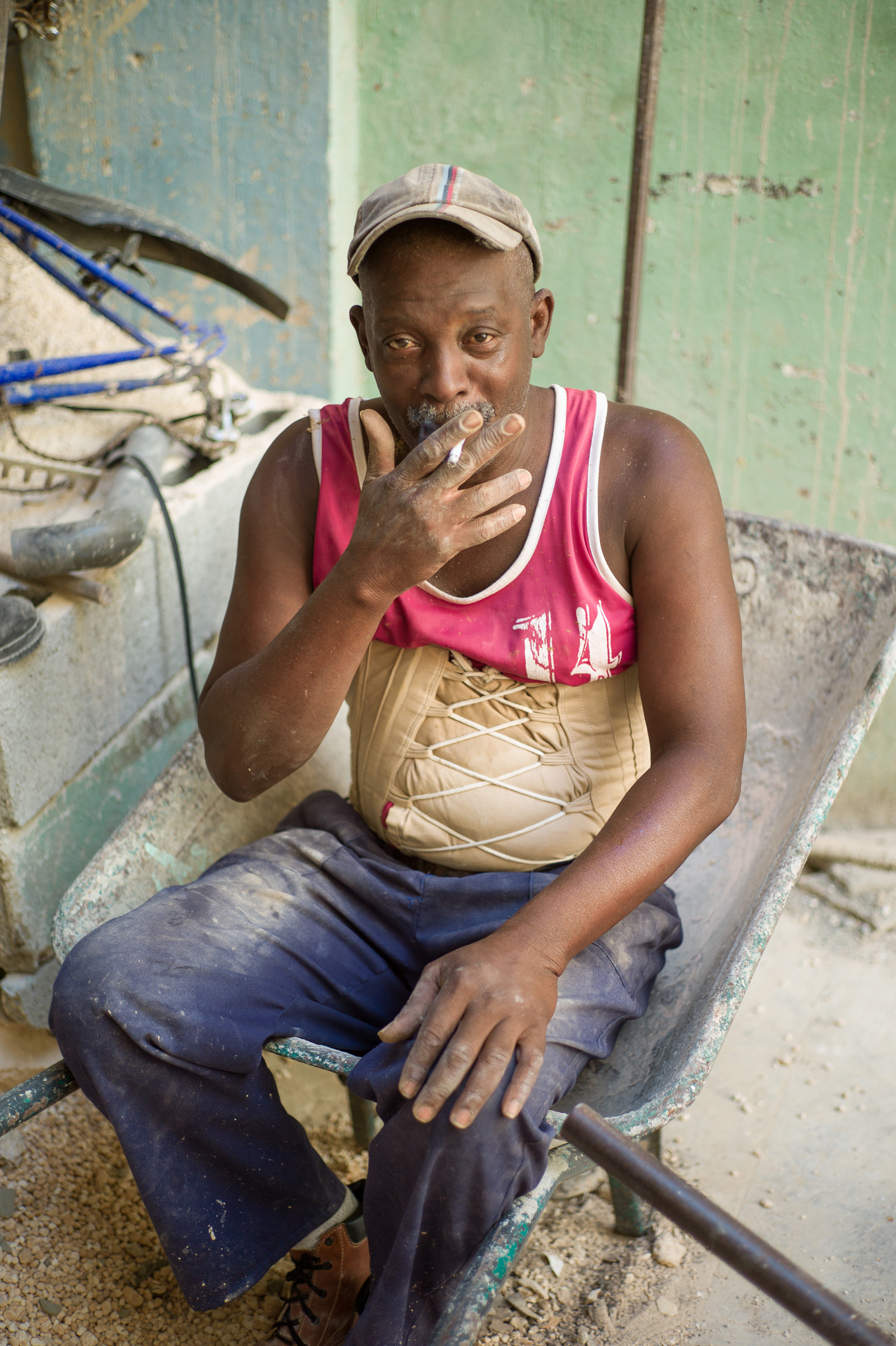 A construction worker having a cigarette break in Havana, Cuba.