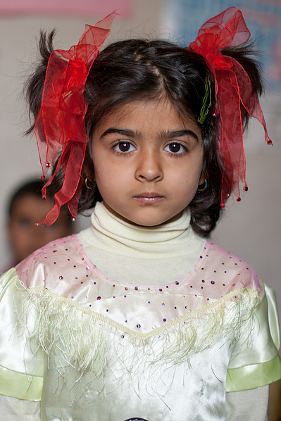 Colour portraits of children in festive clothing, photographed for UNICEF Iran in their kindergartens in West Azerbaijan, Iran.