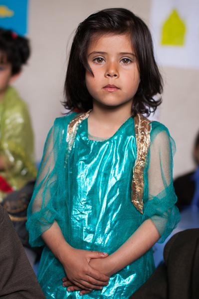 Colour portraits of children in festive clothing, photographed for UNICEF Iran in their kindergartens in West Azerbaijan, Iran.