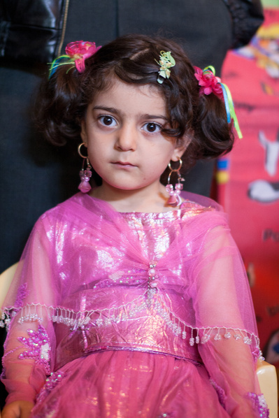 Colour portraits of children in festive clothing, photographed for UNICEF Iran in their kindergartens in West Azerbaijan, Iran.