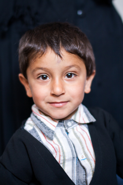 Colour portraits of children in festive clothing, photographed for UNICEF Iran in their kindergartens in West Azerbaijan, Iran.