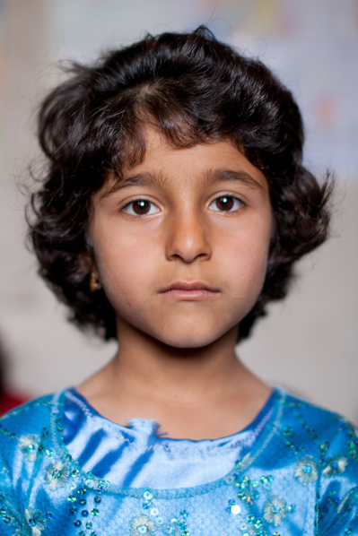Colour portraits of children in festive clothing, photographed for UNICEF Iran in their kindergartens in West Azerbaijan, Iran.